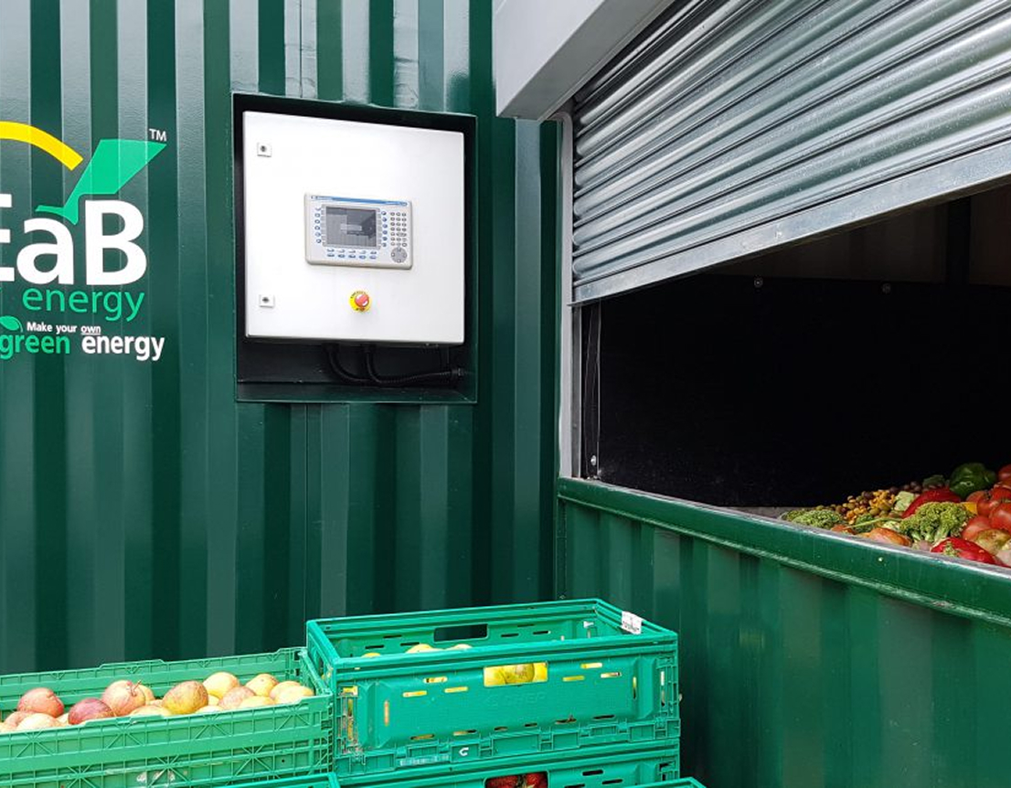 A containerised Anaerobic Digestion unit, the Flexibuster™, with food being loaded into the unit ready to be turned into waste.